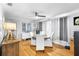 Bright dining room with hardwood floors, neutral decor, and contemporary furnishings, ready for gatherings at 3307 S Manhattan Ave, Tampa, FL 33629