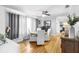 Cozy dining area with hardwood floors, neutral color palette, and abundant natural light at 3307 S Manhattan Ave, Tampa, FL 33629