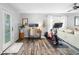 Bright, multipurpose living space with wood floors, home office and workout area near the sliding glass door at 3307 S Manhattan Ave, Tampa, FL 33629