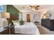 Spacious bedroom with a plush bed, stylish furniture, and a calming color scheme for relaxation at 35695 Durand Ct, Zephyrhills, FL 33541