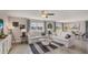 Bright living room with lake views and neutral furnishings at 35695 Durand Ct, Zephyrhills, FL 33541