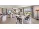 Open concept living and dining room with tile flooring and lake views at 35695 Durand Ct, Zephyrhills, FL 33541