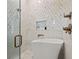 This bathroom showcases a free-standing tub, marble tile, and bronze fixtures at 3721 Iris N St, St Petersburg, FL 33704