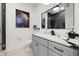 Modern bathroom featuring gray vanity, galaxy art, and tiled shower at 3721 Iris N St, St Petersburg, FL 33704