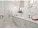 Bright bathroom featuring double vanity with marble countertops and modern fixtures at 3721 Iris N St, St Petersburg, FL 33704