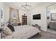 Bedroom featuring king bed, chandelier, and sitting area with a view at 3721 Iris N St, St Petersburg, FL 33704