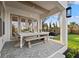 This covered patio boasts a dining area, neutral decor, and access to a backyard at 3721 Iris N St, St Petersburg, FL 33704