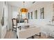 Bright dining area featuring a wine rack, stylish lighting fixture, and white furniture at 3721 Iris N St, St Petersburg, FL 33704