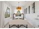 Bright dining area featuring a wine rack, stylish lighting fixture, and comfortable seating at 3721 Iris N St, St Petersburg, FL 33704