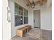 Cozy entryway featuring decorative windows, wooden bench, and stylish lighting at 3721 Iris N St, St Petersburg, FL 33704