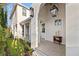 Charming front porch featuring brick flooring, decorative lighting, and refined decor at 3721 Iris N St, St Petersburg, FL 33704