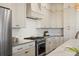 Well lit kitchen featuring stainless steel appliances and upgraded hardware throughout the room at 3721 Iris N St, St Petersburg, FL 33704