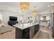 Open-concept kitchen with a large island flows seamlessly into the living area, perfect for entertaining at 3721 Iris N St, St Petersburg, FL 33704