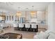Open concept floor plan featuring living and dining areas off of the kitchen and island with bar stool seating at 3721 Iris N St, St Petersburg, FL 33704