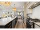 Spacious kitchen features stainless appliances, a marble-topped island, and access to the dining area at 3721 Iris N St, St Petersburg, FL 33704
