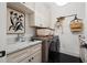 Neat laundry room with modern washer/dryer and convenient storage at 3721 Iris N St, St Petersburg, FL 33704