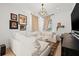 Cozy living room with an oversized white couch and a modern light fixture at 3721 Iris N St, St Petersburg, FL 33704