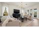 Bright living room with hardwood floors, stylish sofas, and a view to the outdoors at 3721 Iris N St, St Petersburg, FL 33704