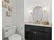 Stylish powder room with elegant fixtures, a modern vanity, and decorative accents at 3721 Iris N St, St Petersburg, FL 33704
