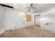 Bedroom featuring plywood flooring, a covered window, ceiling fan, and an adjacent doorway ready for customization at 4029 13Th S Ave, St Petersburg, FL 33711