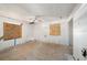 Bedroom showing boarded up windows and holes in the walls and ceiling at 4029 13Th S Ave, St Petersburg, FL 33711