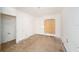 Bedroom featuring plywood flooring and a covered window ready to renovate into a cozy retreat at 4029 13Th S Ave, St Petersburg, FL 33711