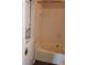 The bathroom features a shower and tub combination along with a stacked washer/dryer unit at 4211 Chatham Oak Ct # 122, Tampa, FL 33624