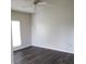 Bright bedroom with modern dark floors and ample natural light at 4211 Chatham Oak Ct # 122, Tampa, FL 33624