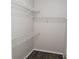 A walk-in closet with white wire shelving provides ample storage space at 4211 Chatham Oak Ct # 122, Tampa, FL 33624