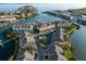 Aerial view of a townhouse community, complete with marina, private pool, mature trees, and well-manicured landscaping at 4339 Spinnaker Cove Ln, Tampa, FL 33615