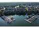 Scenic aerial view of waterfront townhomes with private docks, surrounded by lush greenery and tranquil waters at 4339 Spinnaker Cove Ln, Tampa, FL 33615