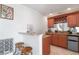 Charming bar area with wooden cabinets, granite countertop, wine storage, and casual seating at 4339 Spinnaker Cove Ln, Tampa, FL 33615