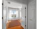 Bright bedroom with wood floors, large window, and light-filled ambiance at 4339 Spinnaker Cove Ln, Tampa, FL 33615