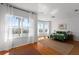 Bright bedroom showcases floor to ceiling windows, hardwood floors, and water view at 4339 Spinnaker Cove Ln, Tampa, FL 33615