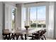 Stylish dining room featuring a large window with water views and modern furnishings at 4339 Spinnaker Cove Ln, Tampa, FL 33615