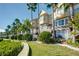 Beautiful townhome exterior, featuring a waterfront location, manicured landscaping, and private deck access at 4339 Spinnaker Cove Ln, Tampa, FL 33615