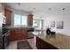 Bright kitchen with granite countertops, stainless steel appliances, and a view of the dining area at 4339 Spinnaker Cove Ln, Tampa, FL 33615