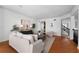 Spacious living area with wood floors, white walls, stylish decor, and an open floor plan at 4339 Spinnaker Cove Ln, Tampa, FL 33615