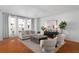 Bright living room with hardwood floors, stylish seating, large windows, and elegant decor at 4339 Spinnaker Cove Ln, Tampa, FL 33615