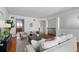 Inviting living room with modern decor, wood flooring, an open layout, and staircase access at 4339 Spinnaker Cove Ln, Tampa, FL 33615