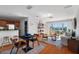 Living room features hard wood floors, dining area, and sliding glass doors to private deck at 4339 Spinnaker Cove Ln, Tampa, FL 33615