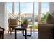 Bright living room with stylish decor, sliding doors to balcony with water view and plush furnishings at 4339 Spinnaker Cove Ln, Tampa, FL 33615