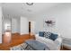 Bright living room features hardwood floors, white walls and modern decor, illuminated by natural light at 4339 Spinnaker Cove Ln, Tampa, FL 33615