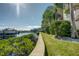 Picturesque waterfront with a landscaped canal bank, showcasing the property's direct access to boating at 4339 Spinnaker Cove Ln, Tampa, FL 33615