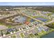 Community aerial view featuring ponds, mature trees, and the Skyway Bridge in the distance at 4819 Windy Hammock Way, Palmetto, FL 34221