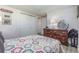 Cozy bedroom with a soft quilt bed, a large wooden dresser and closet at 608 Florida S Cir, Apollo Beach, FL 33572