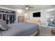 Comfortable bedroom featuring a ceiling fan, large walk-in closet, and an en-suite bathroom with updated shower at 608 Florida S Cir, Apollo Beach, FL 33572
