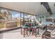 Enclosed patio featuring dining and lounging spaces, providing a cozy outdoor retreat at 608 Florida S Cir, Apollo Beach, FL 33572