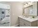 Well-lit bathroom with modern fixtures including a large mirror and marble countertops at 652 Ohio Pl, Sarasota, FL 34236