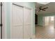 Bedroom with closet and fan, that leads to another room through french doors at 7313 Gaberia Rd, Trinity, FL 34655